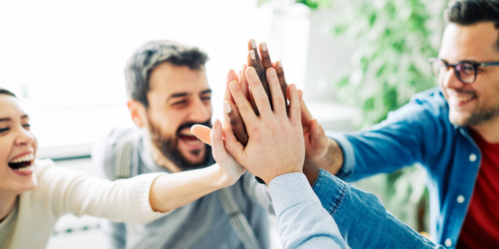 A group of adults high five