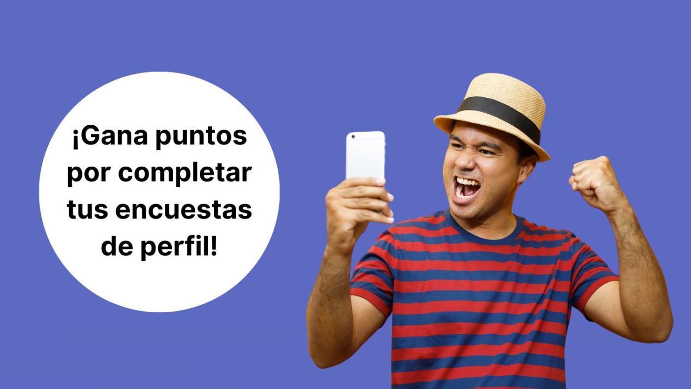 Imagen de un hombre mirando con cara de alegría y emoción la pantalla de su teléfono celular y el texto "gana puntos por completar tus encuestas de perfil"