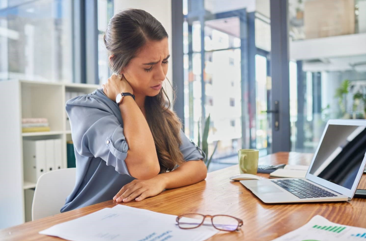 An exhausting woman sitting in the office