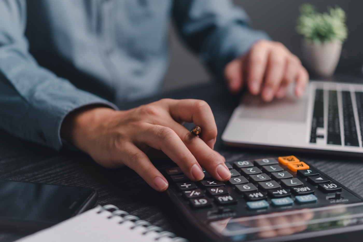 man using a calculator