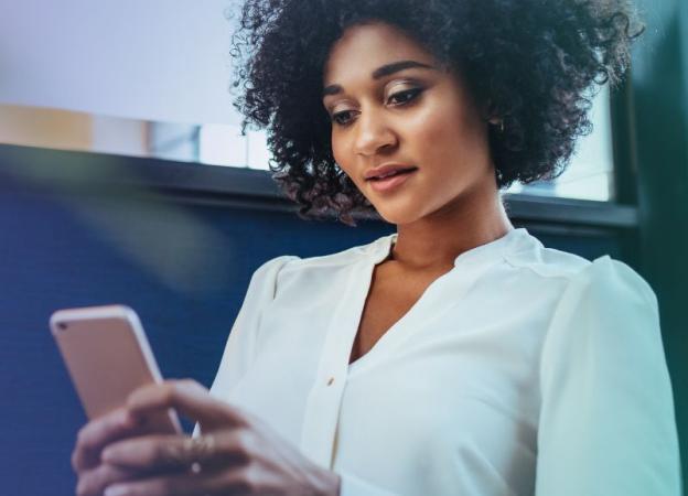 Image of a woman looking at her phone