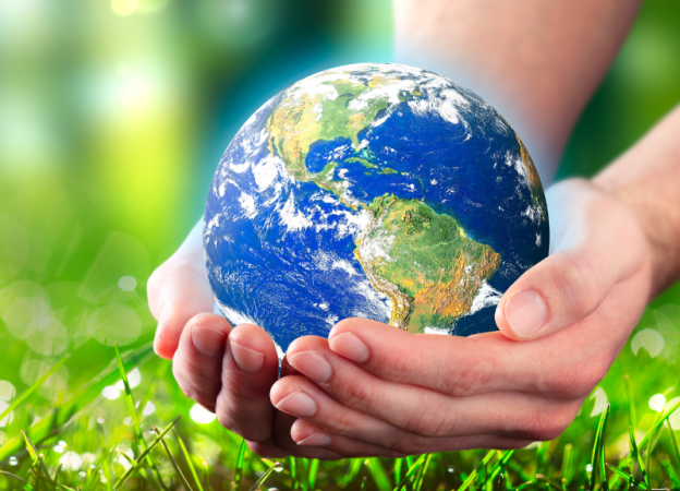 Hands holding an Earth globe