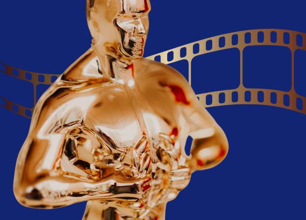 Golden Oscar statue on a dark blue background
