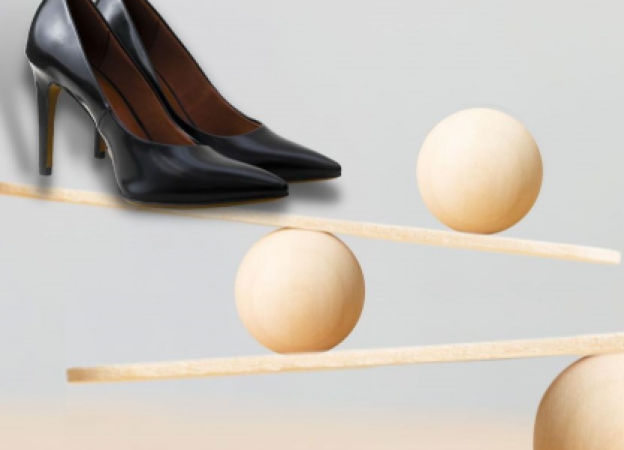 Business shoes balancing on the sea-saw 