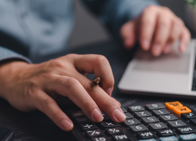 man using a calculator